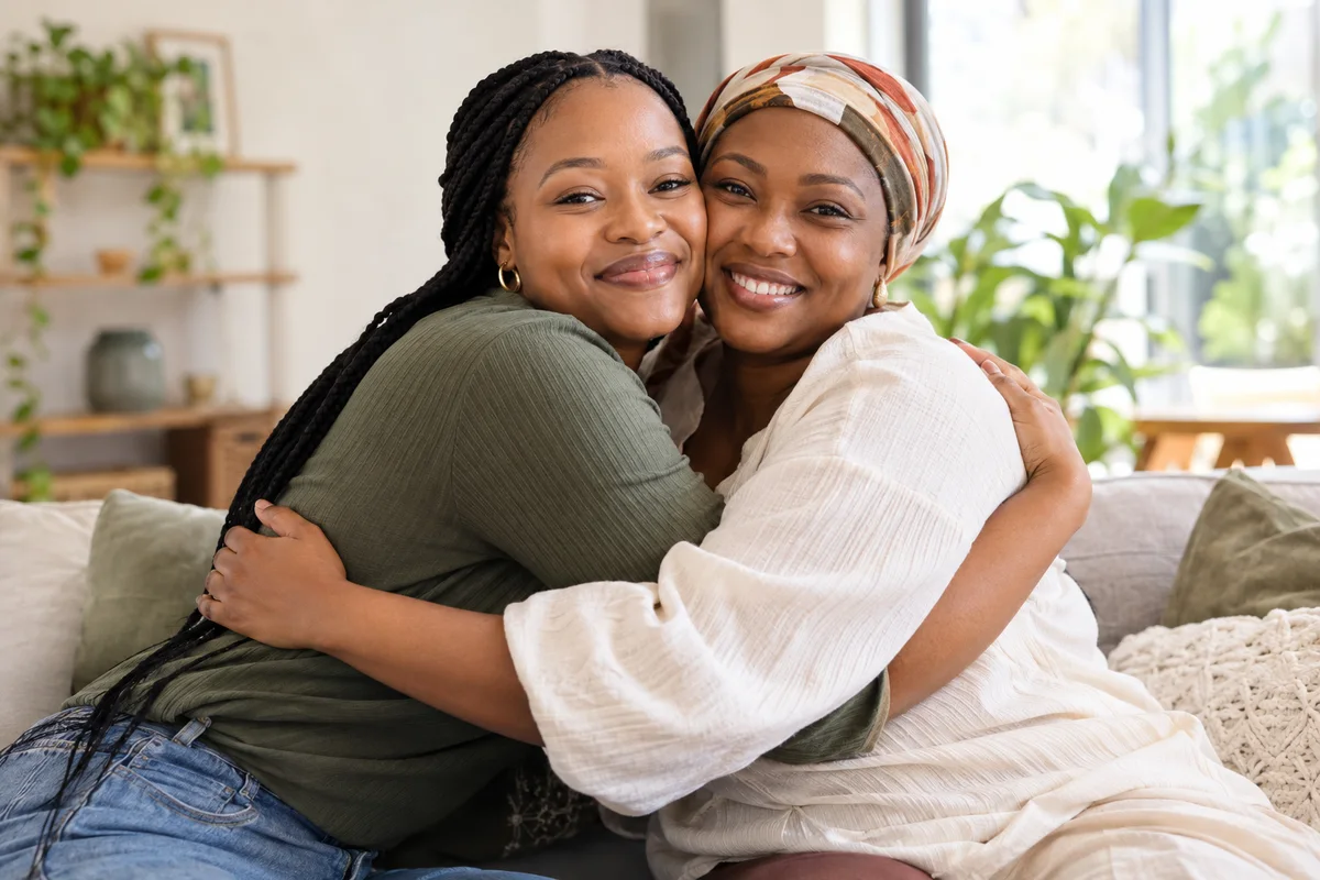 Two women sharing a warm, supportive hug